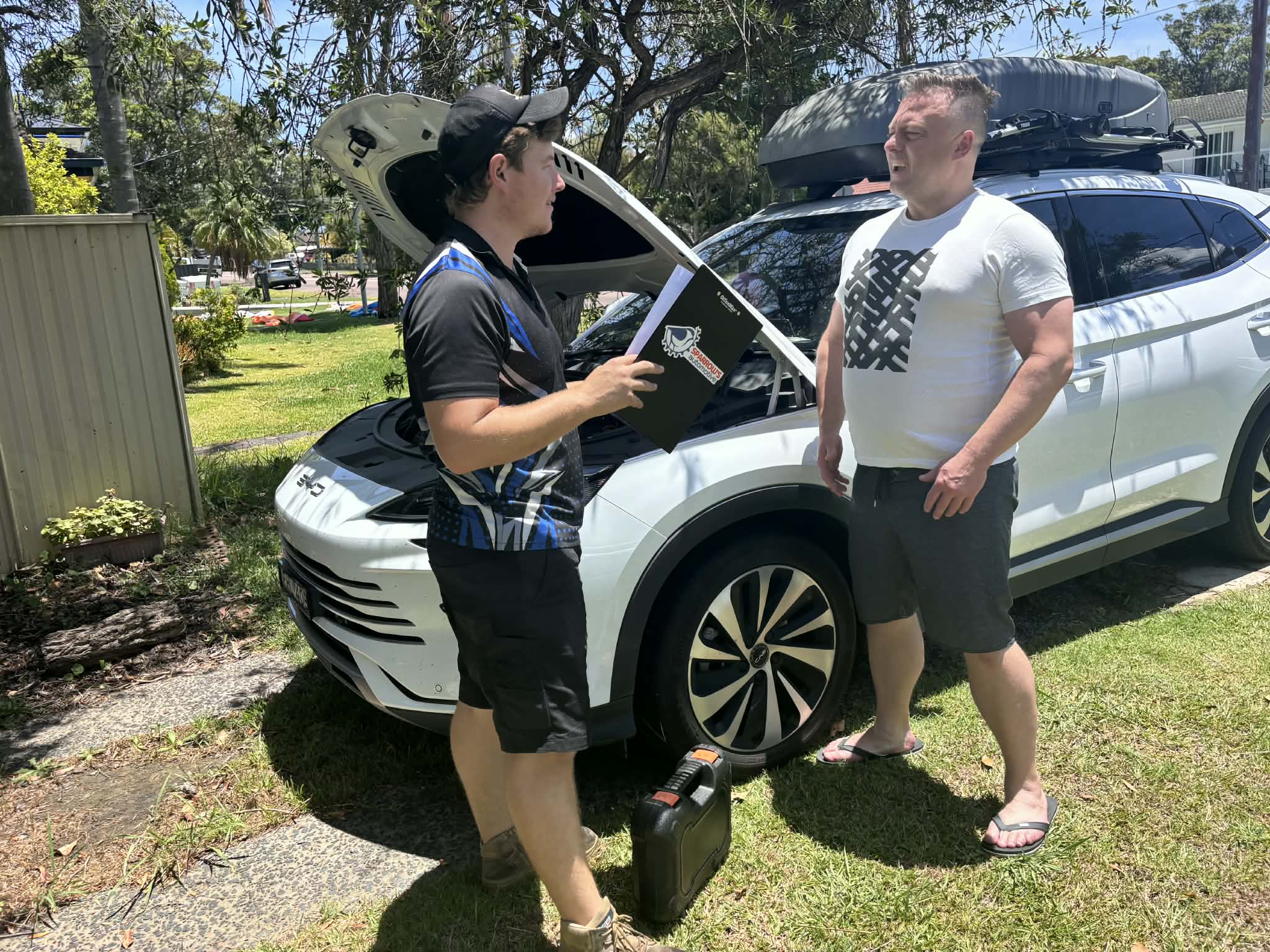 Dean explaining repair options and providing a clear quote to a customer during a mobile mechanic visit on the Central Coast NSW