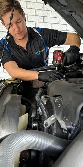 Dean from Sparrow's Automotive working under the bonnet during a mobile repair on the Central Coast NSW